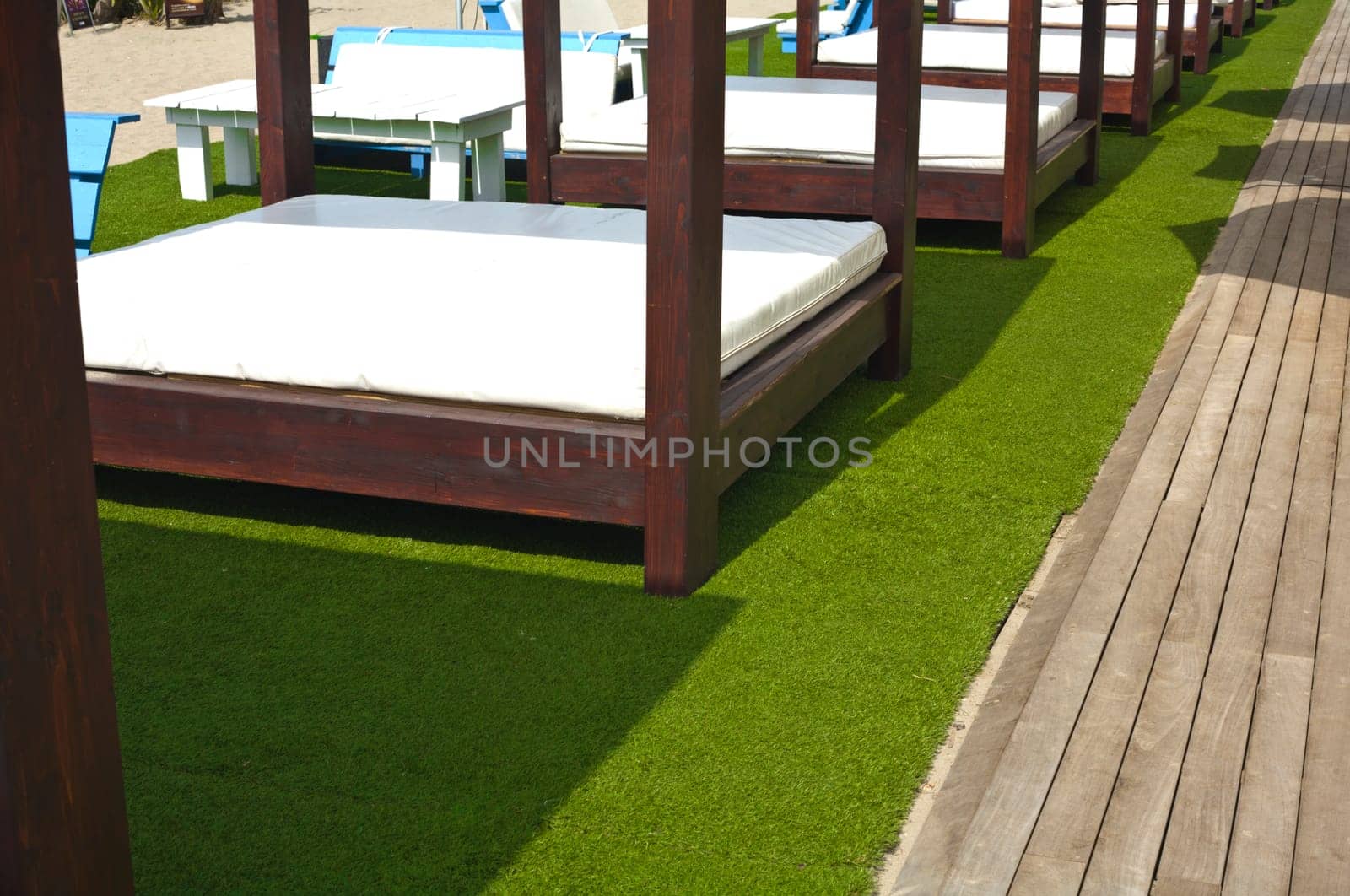 Lounger beds on beach relaxing resort, south of Spain