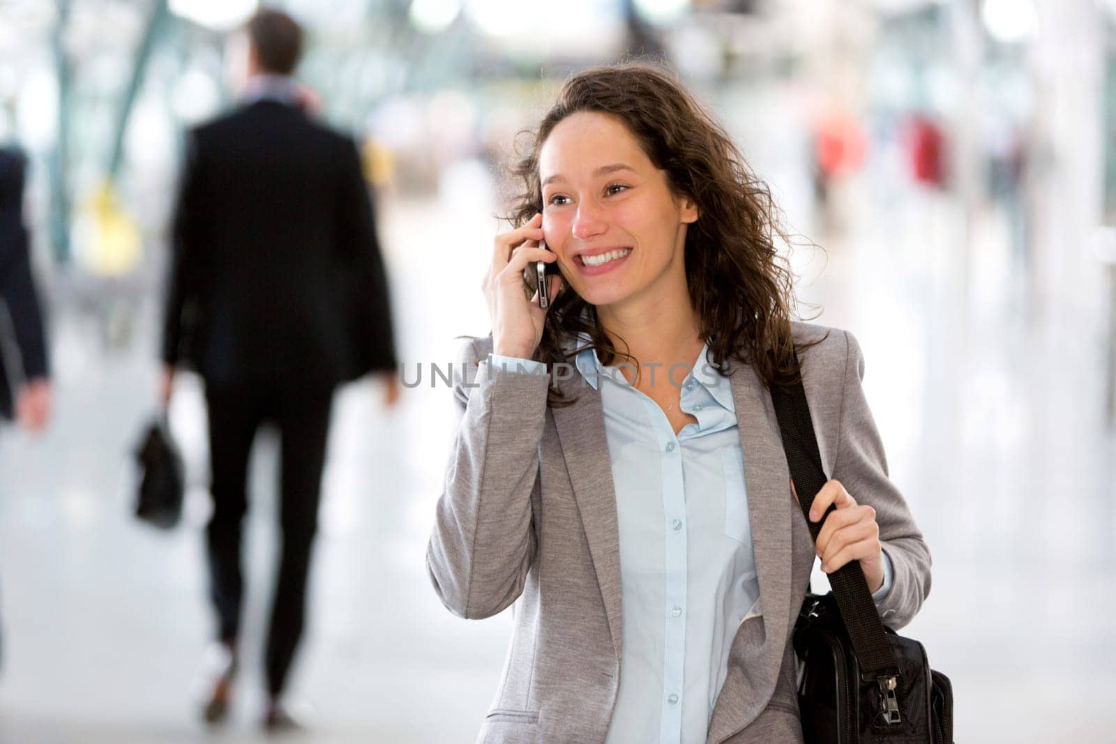 View of a Young attractive business woman using smartphone