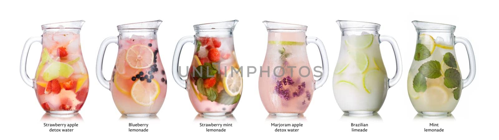 Collection of different drinks in glass pitchers. Glasses full of spritzers, schorle,lemonade,iced tea, detox waters. Healthy eating