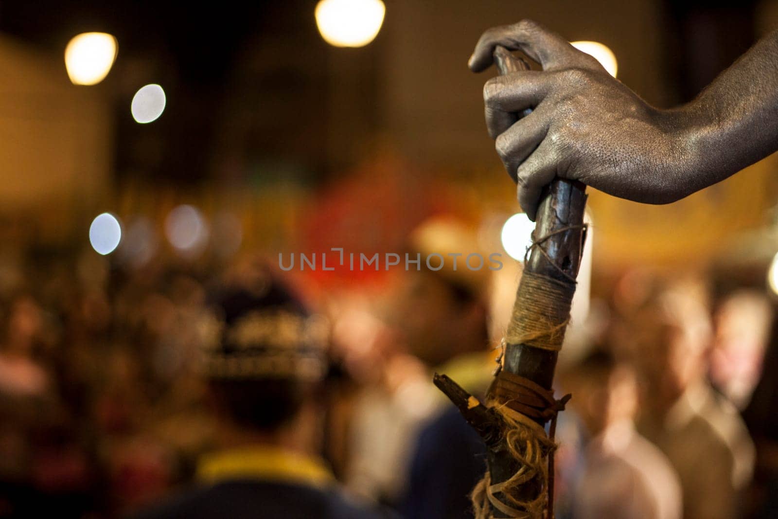 Costumed participant at the Almossassa Culture Festival dressed as a faun. Magic cane detail