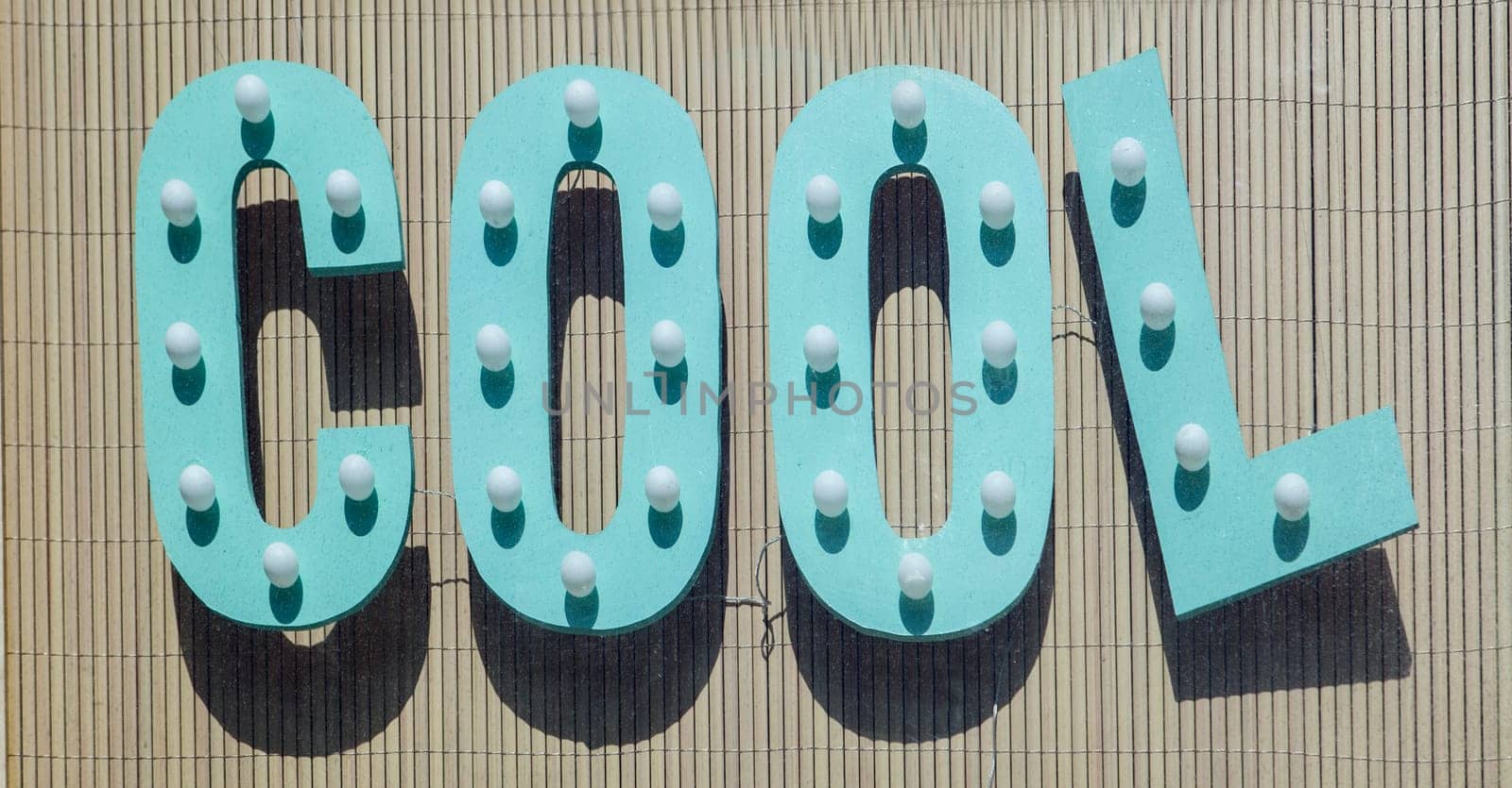 Illuminated sign with letters forming the word Cool