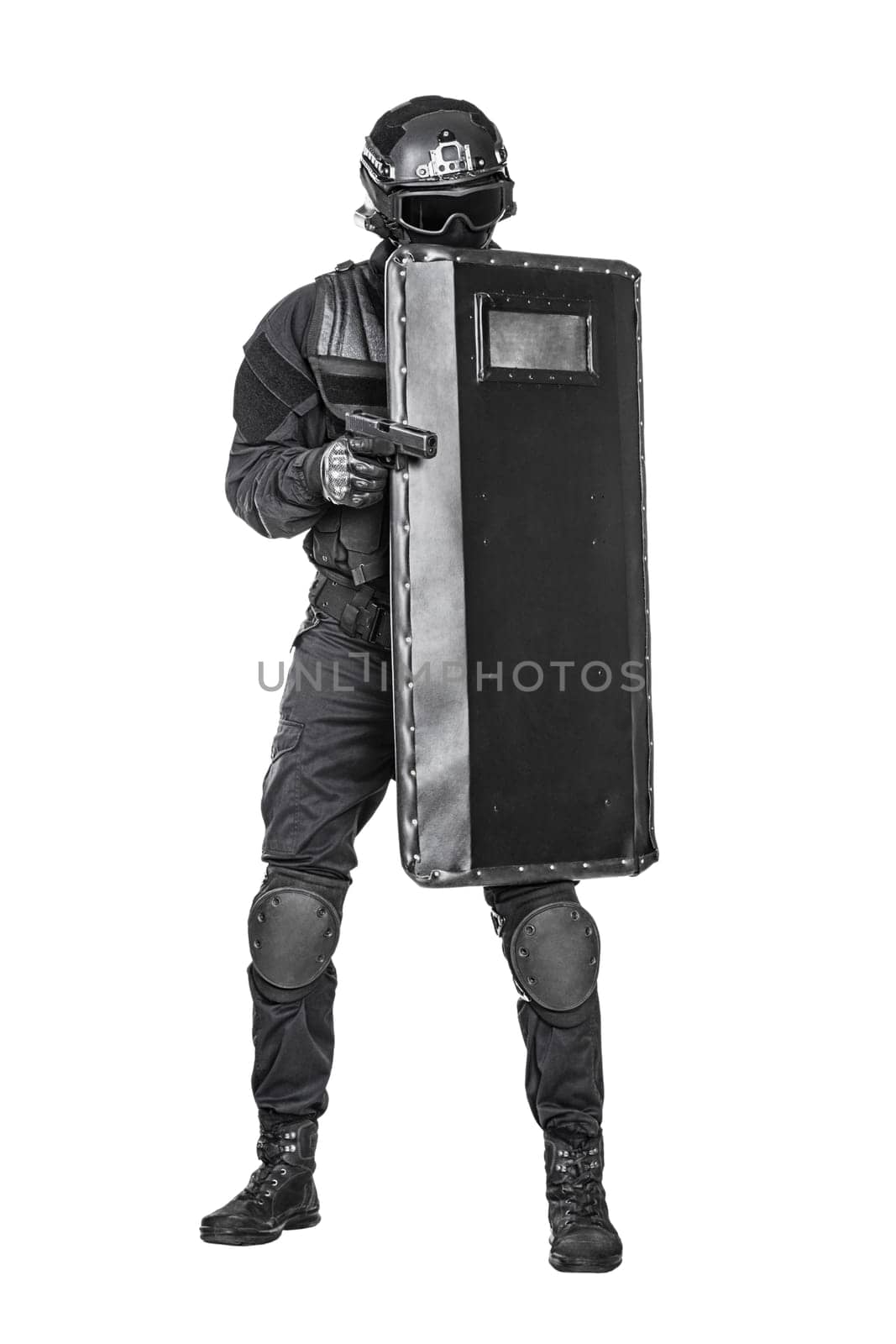 Spec ops police officer SWAT with ballistic shield studio shot