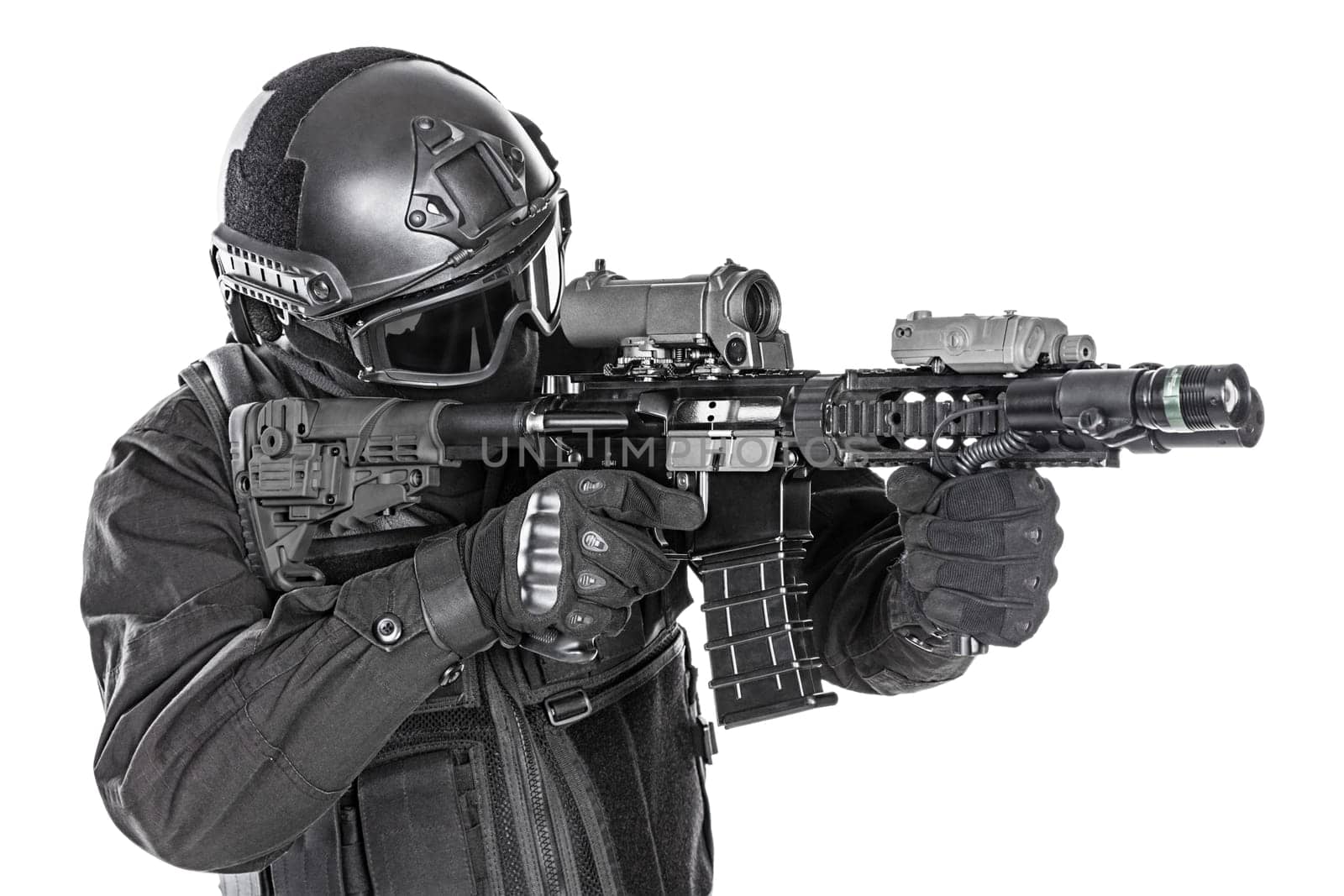 Spec ops police officer SWAT in black uniform and face mask studio shot