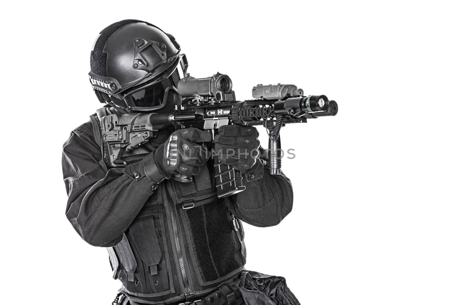 Spec ops police officer SWAT in black uniform and face mask studio shot