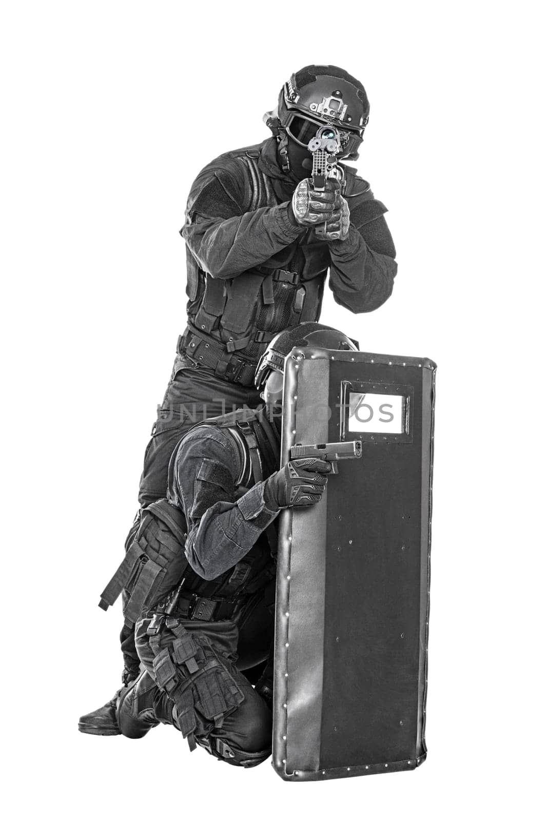 Spec ops police officer SWAT with ballistic shield studio shot