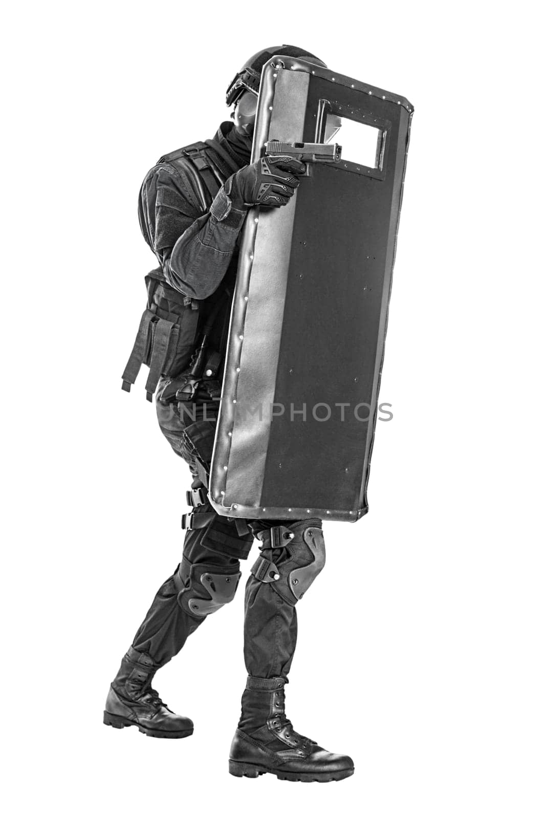 Spec ops police officer SWAT with ballistic shield studio shot