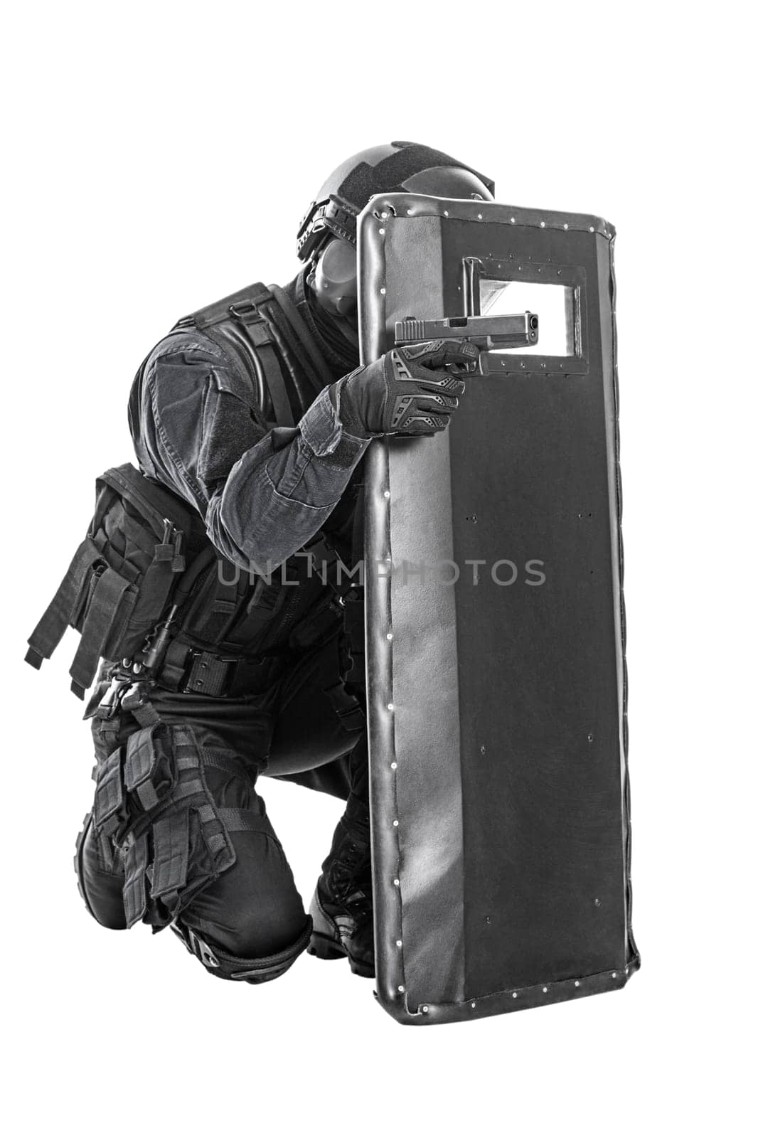 Spec ops police officer SWAT with ballistic shield studio shot