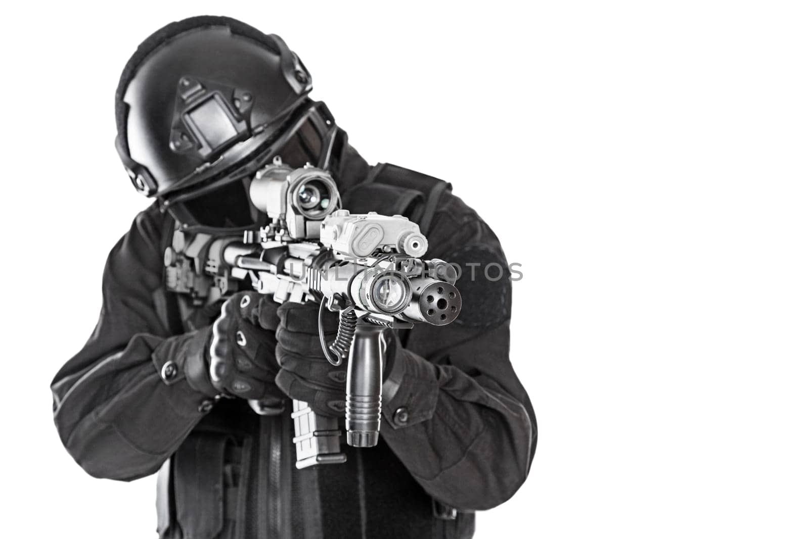 Spec ops police officer SWAT in black uniform and face mask studio shot