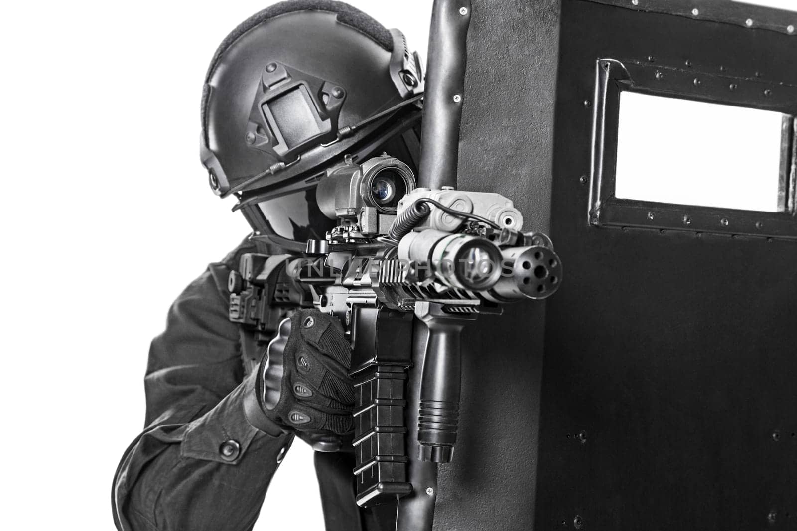 Spec ops police officer SWAT with ballistic shield studio shot