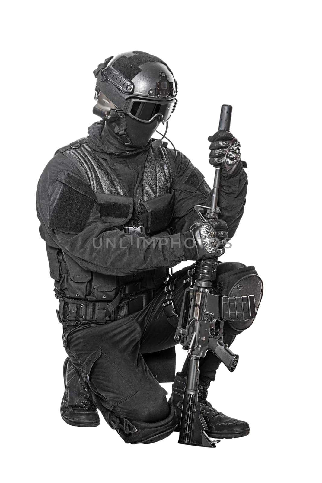 Spec ops police officer SWAT in black uniform and face mask studio shot