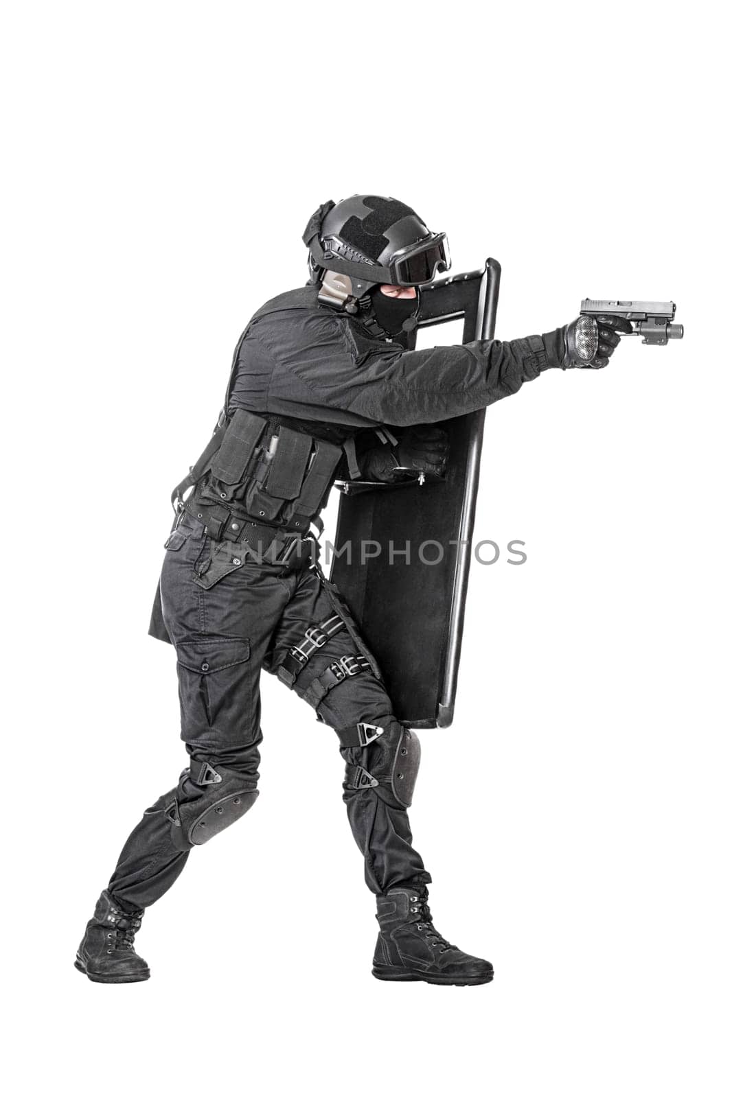 Spec ops police officer SWAT with ballistic shield studio shot