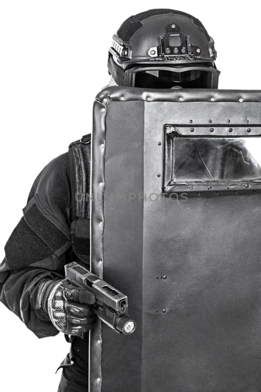 Spec ops police officer SWAT with ballistic shield studio shot