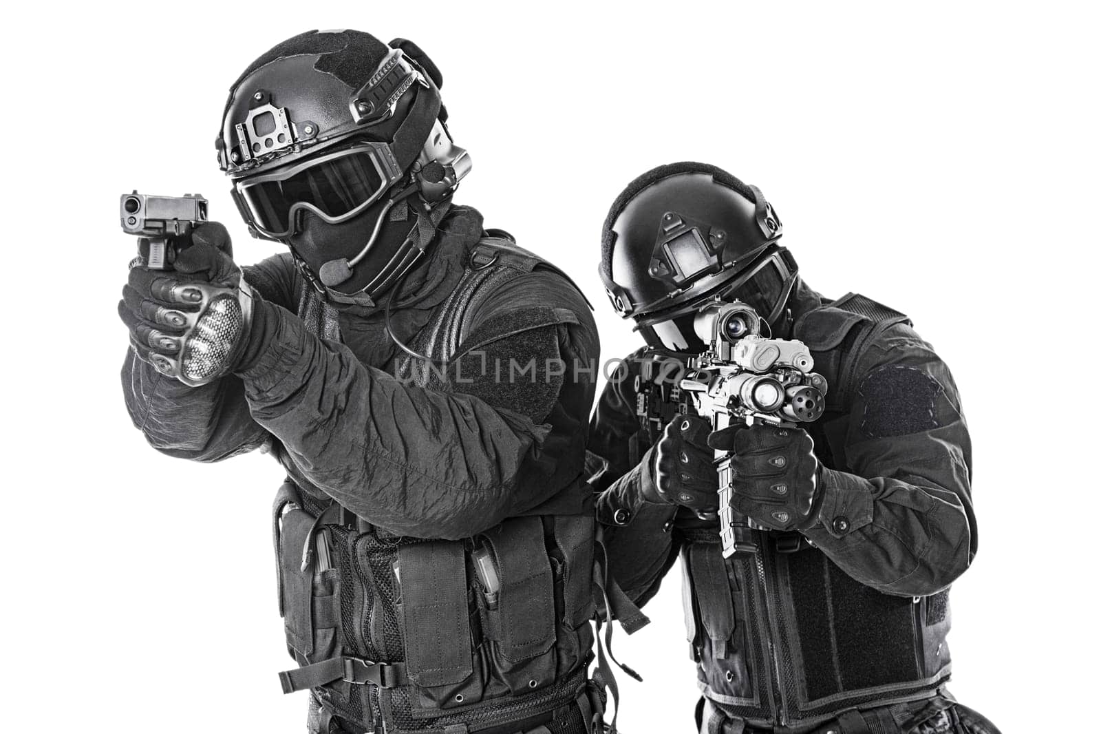 Spec ops police officers SWAT in black uniform and face mask studio shot