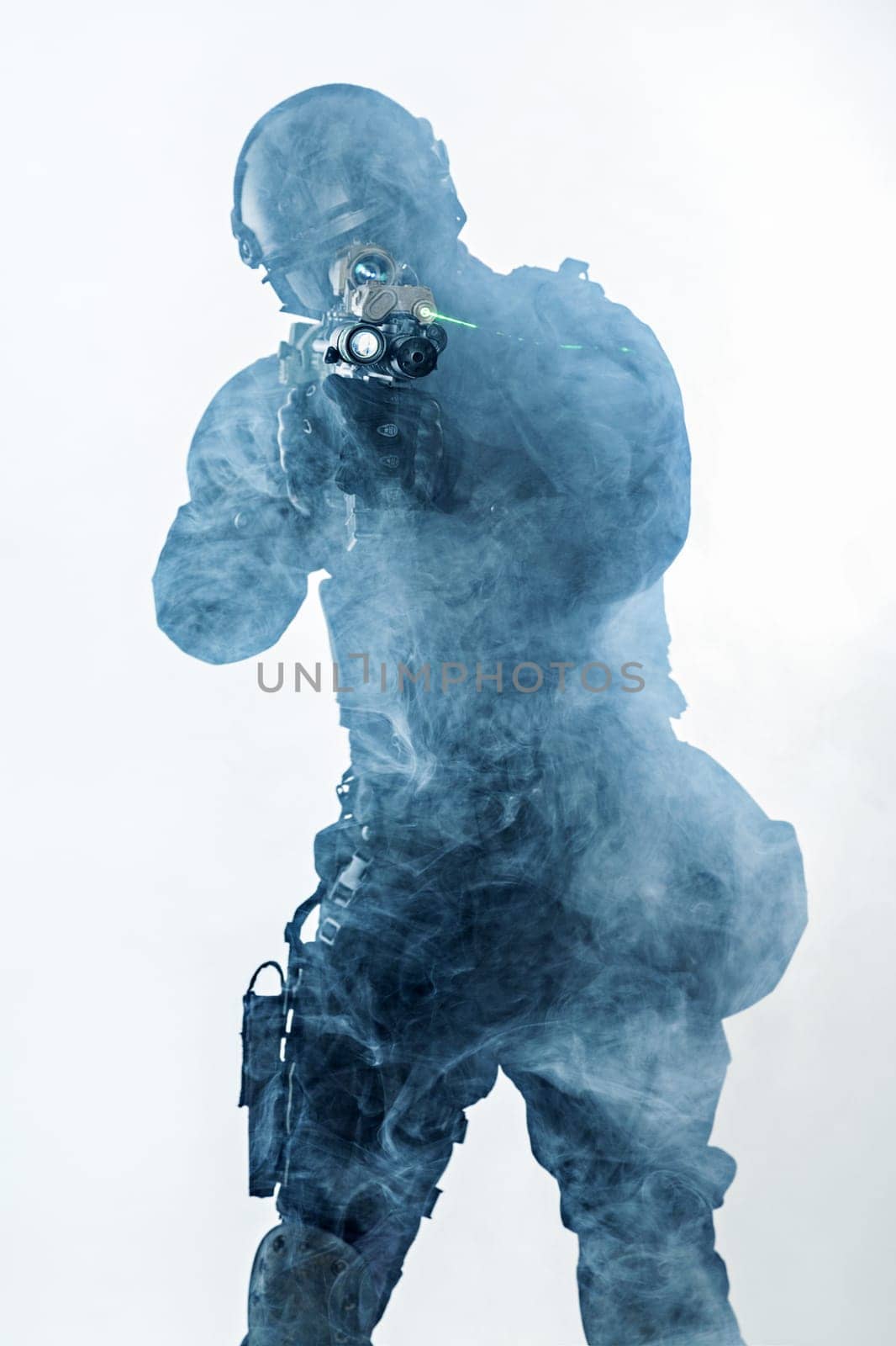 police officer SWAT in black uniform and face mask studio shot