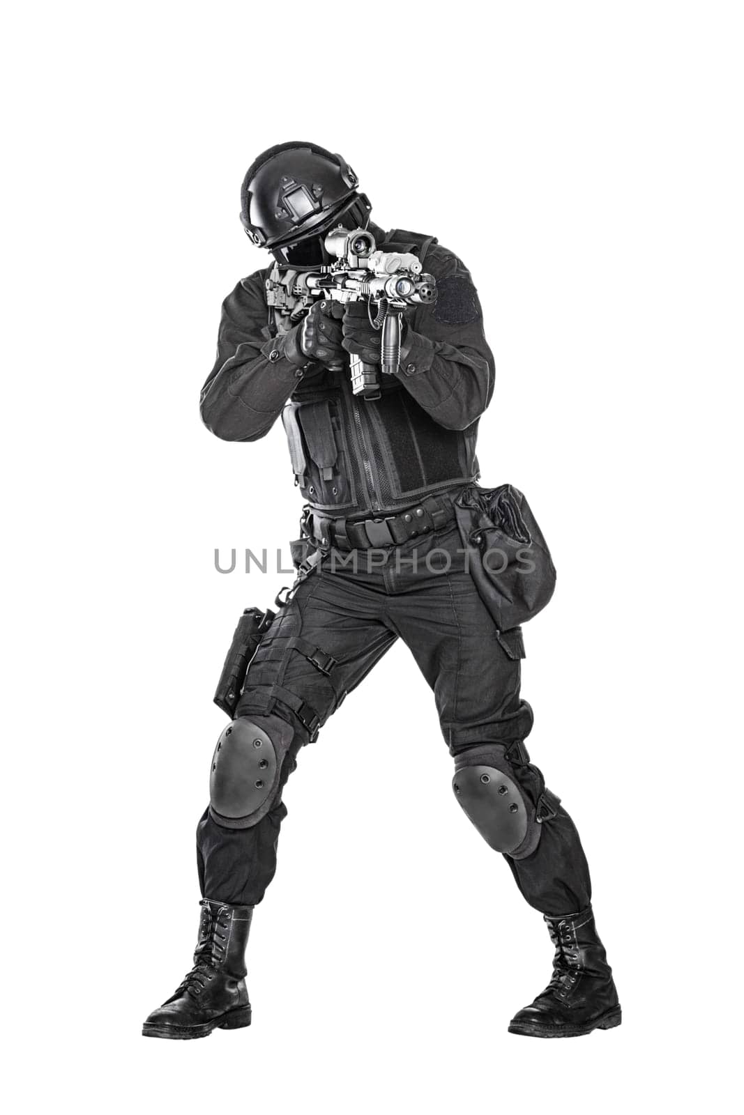 Spec ops police officer SWAT in black uniform and face mask studio shot