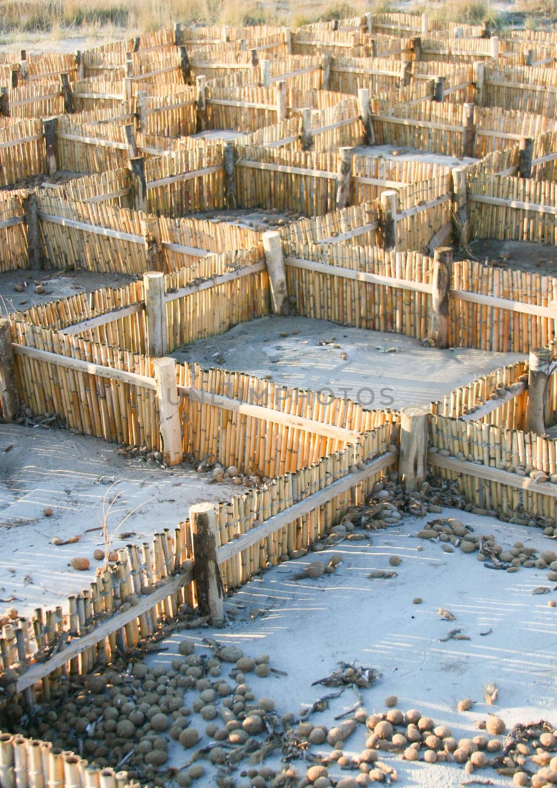 Barrier for sand. Useful against shoreline erosion