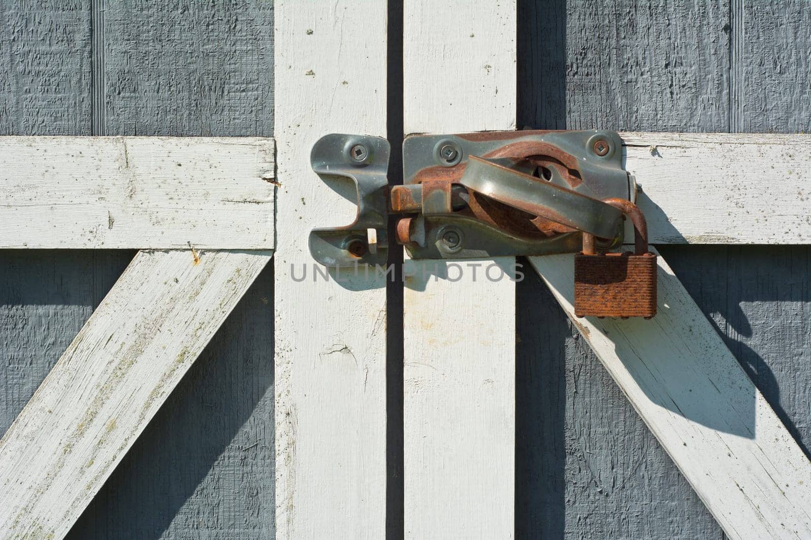 Tool Shed Door with Rusty Lock and Handle