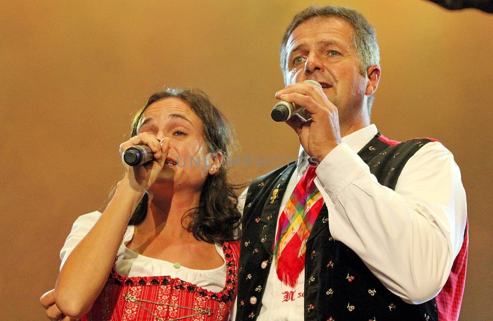 Norbert Rier,frontman of the Kastelruther Spatzen at the 'Spatzen-Fest 2012' in a vocal duet with daughter Marion.