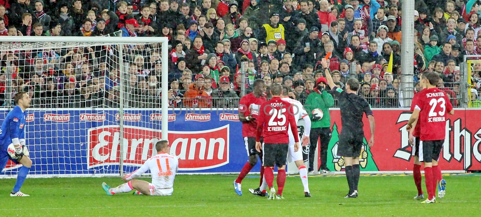 Referee Florian Meyer shows Fallou Diagne of SC Freiburg the red card after emergency brake