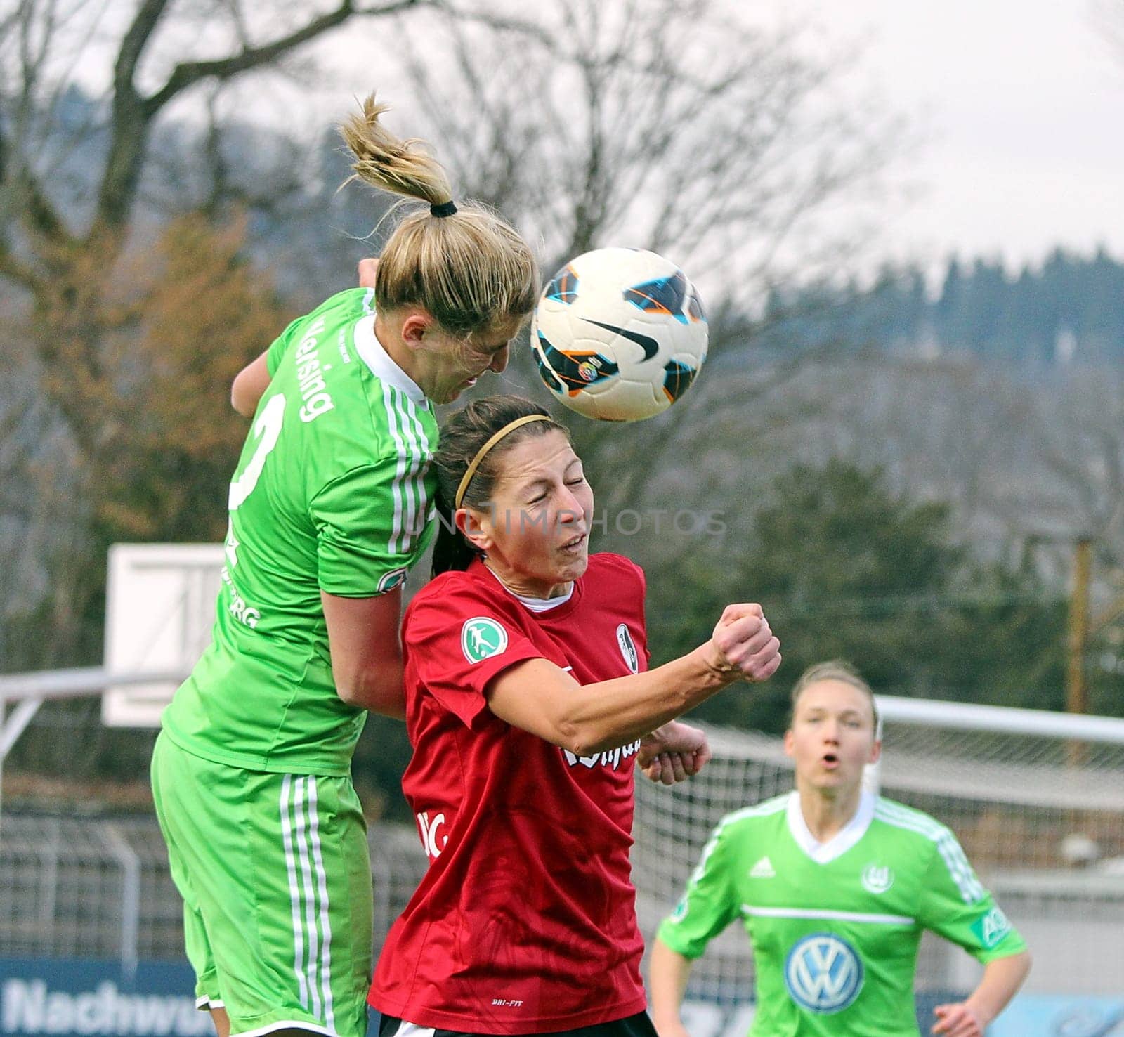 DFB-Pokal Semi-final: SC Freiburg - VfL Wolfsburg on 2.03.2013 0:5 (0:1)-Headball-Duel between the Freiburger Carmen Höfflin and Luisa Wensing from VfL Wolfsburg