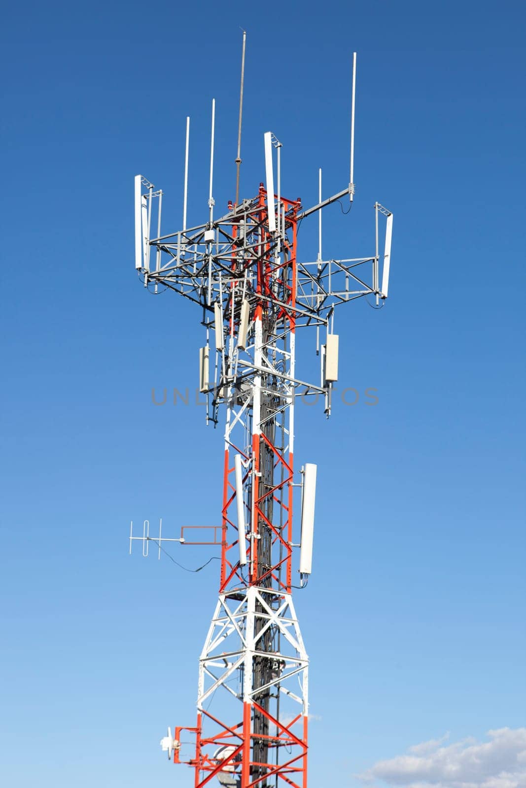 Mobile phone Telecommunication Radio antenna Tower over blue sky