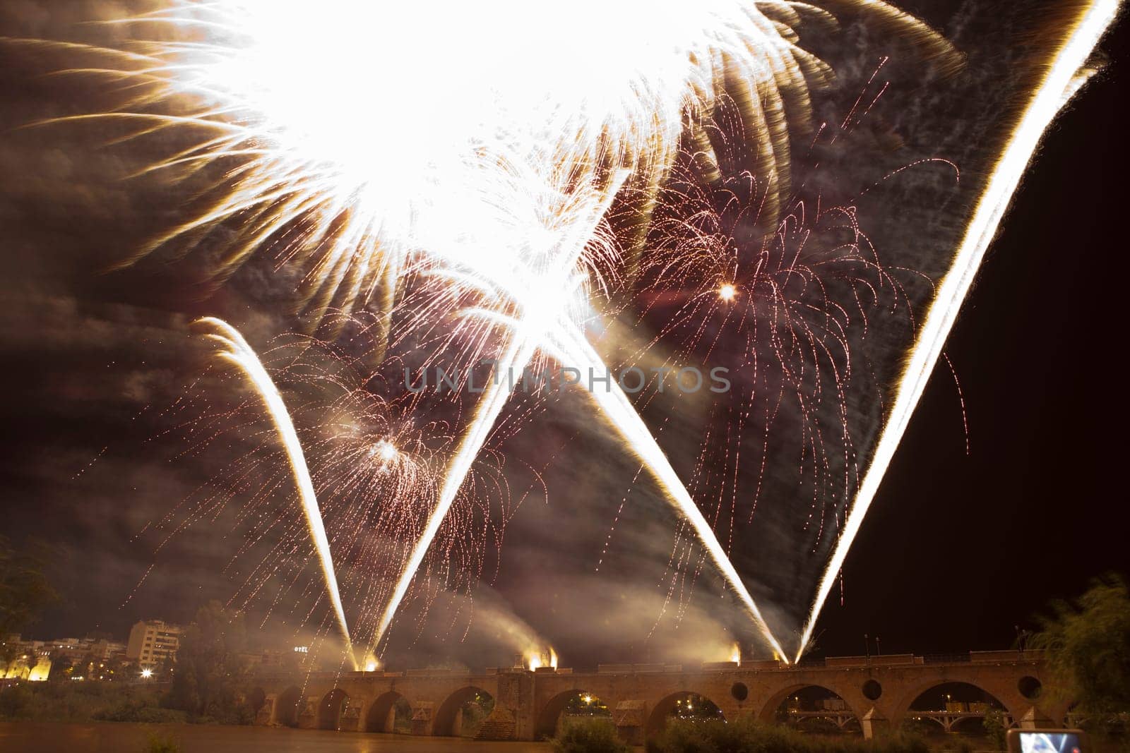 People observing the Puente de Palmas fireworks at San Juan festivity night