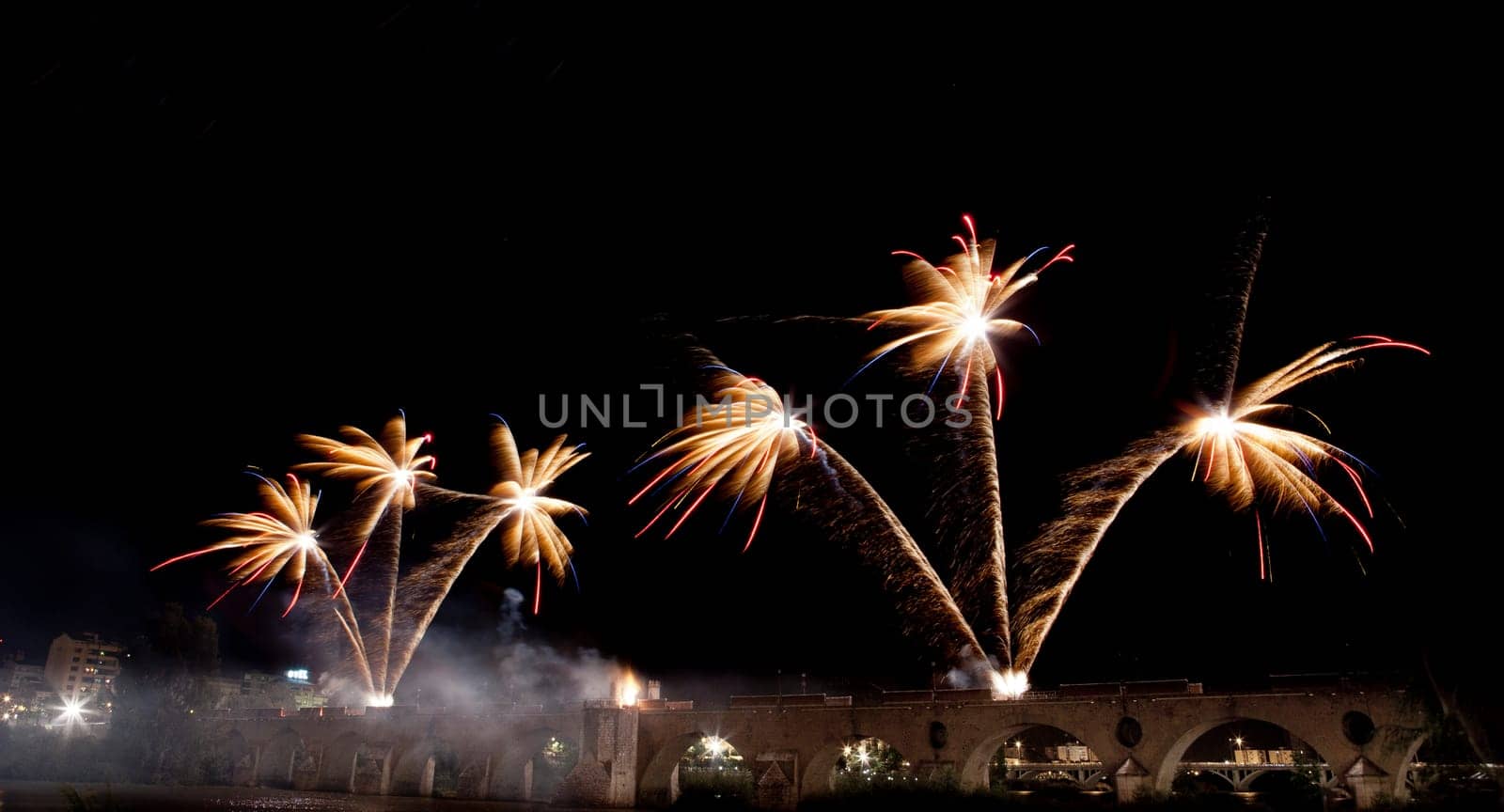 People observing the Puente de Palmas fireworks at San Juan festivity night