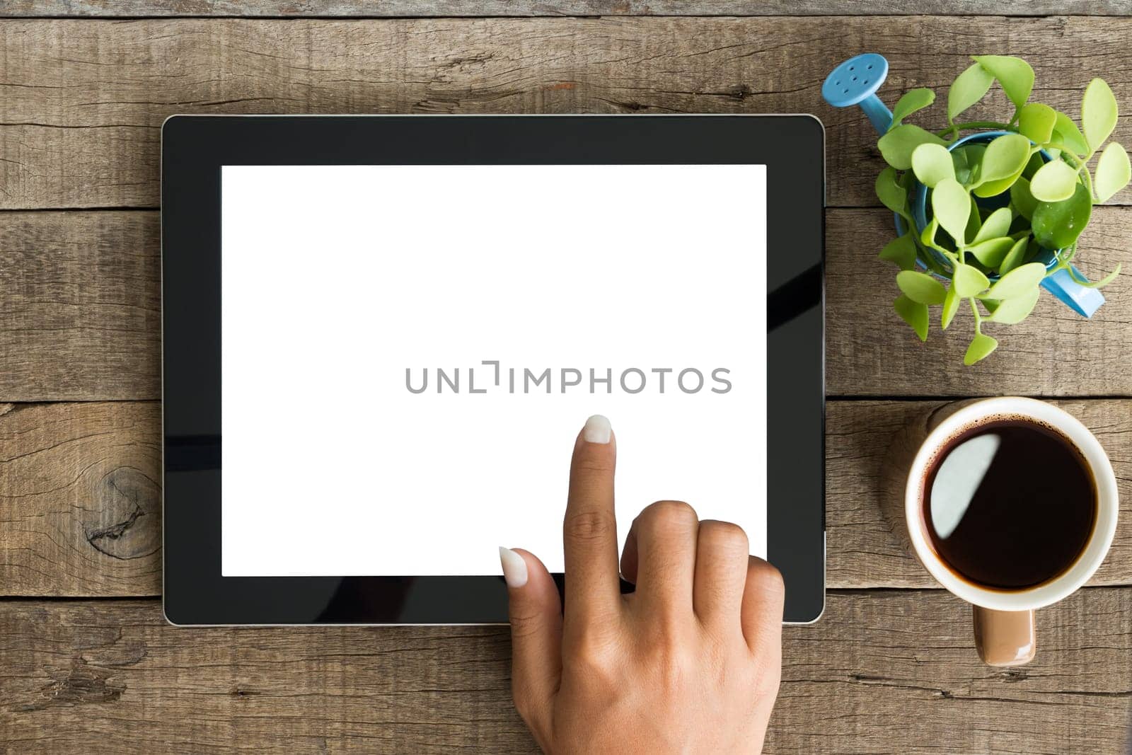 hand using tablet on top view