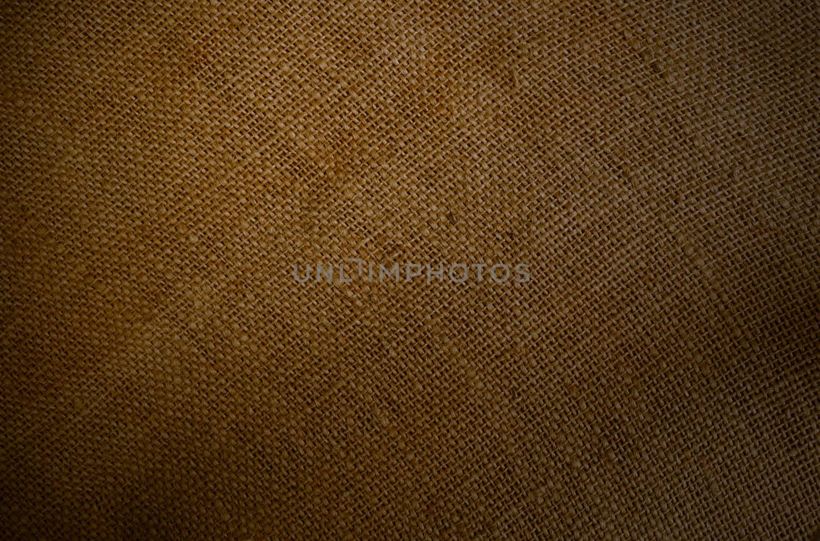 Coarse brown fabric of a jutesack as a rustic background