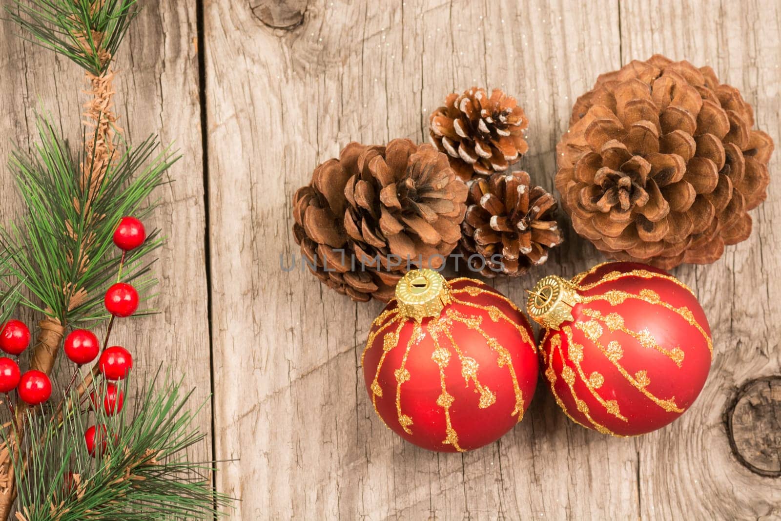 Christmas baubles and pine cones top view