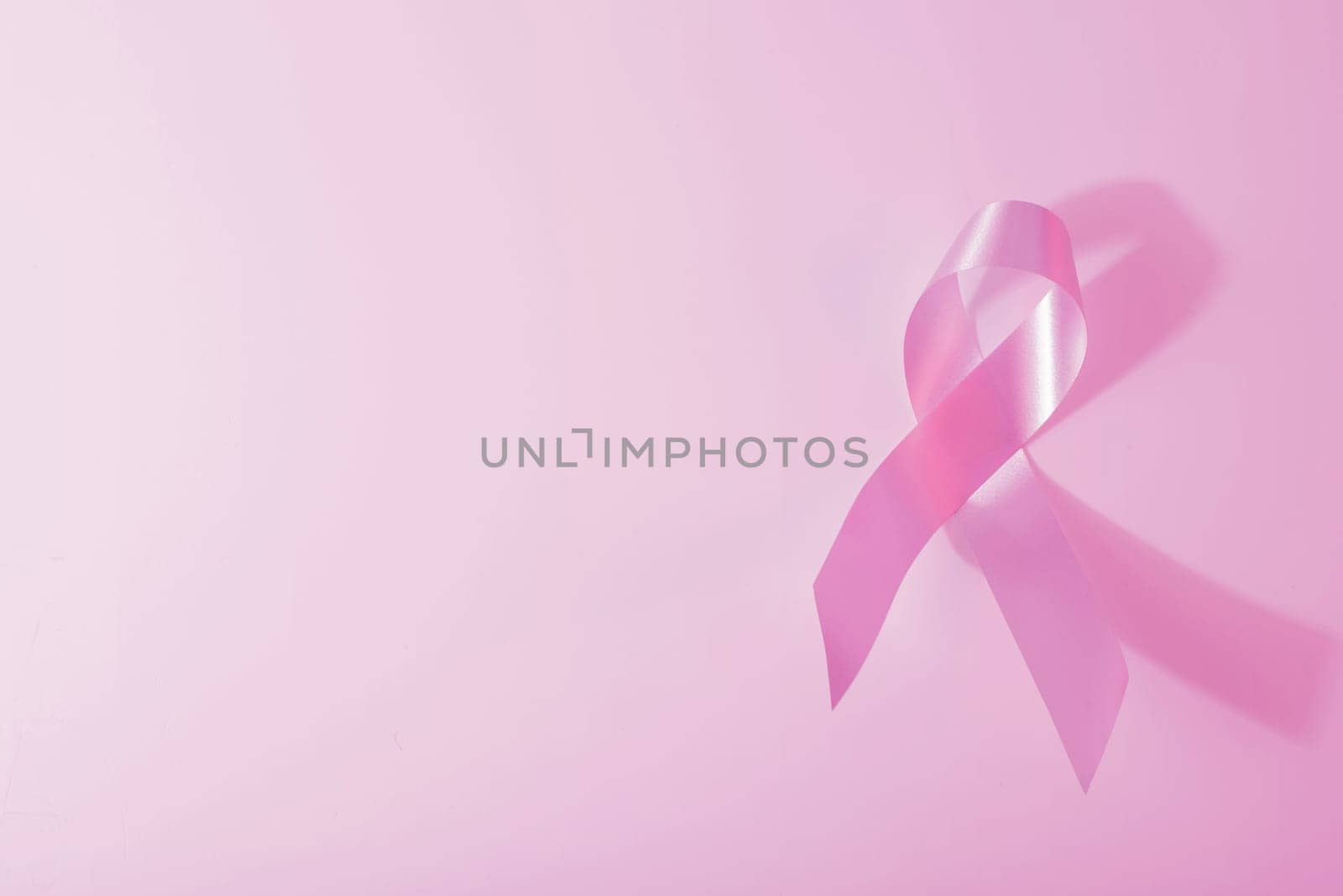 Breast cancer awareness pink ribbon and background. Ideal for social media campaign or web.