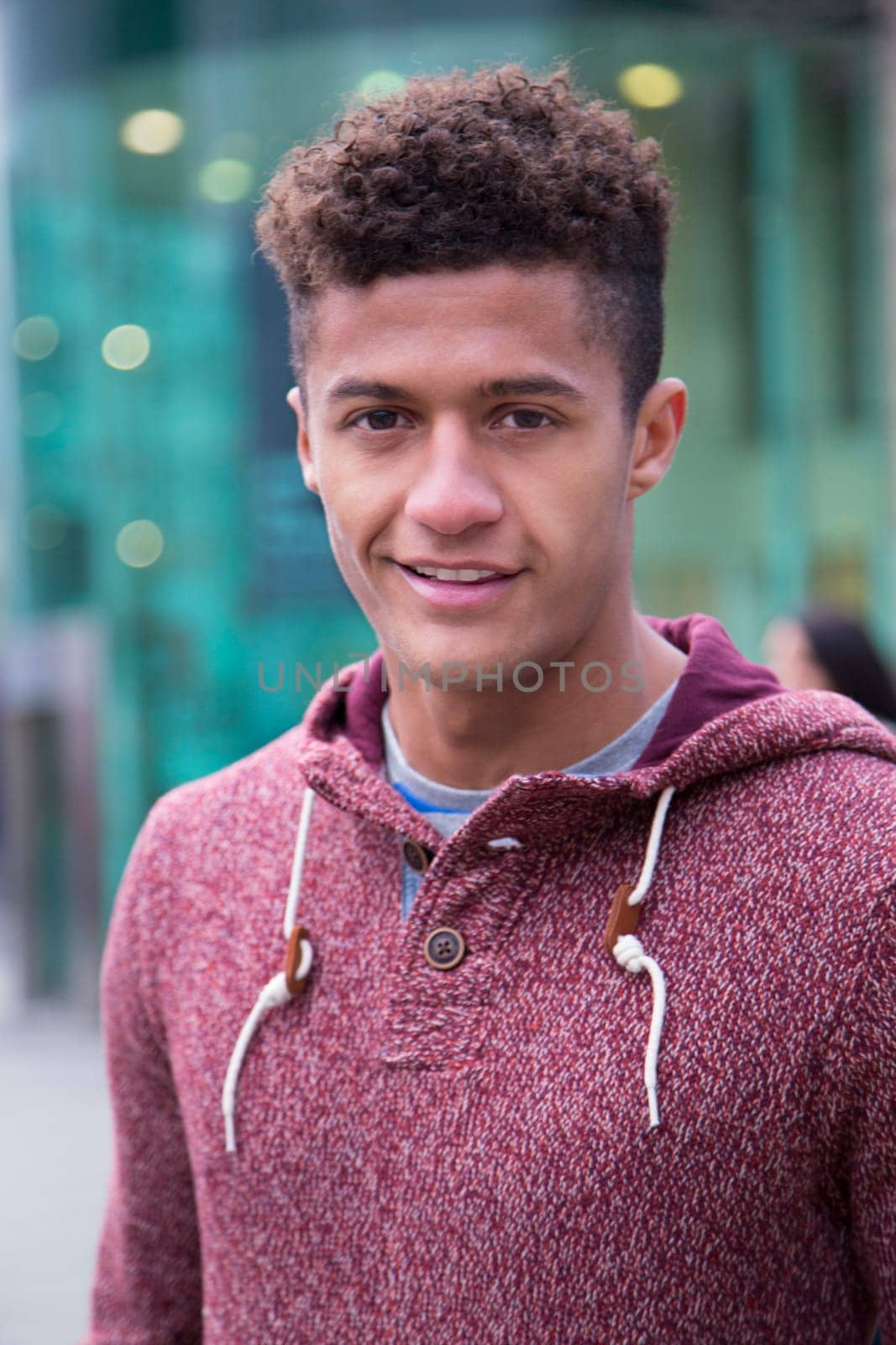 Portrait of an attractive, young, mixed-race man in the city