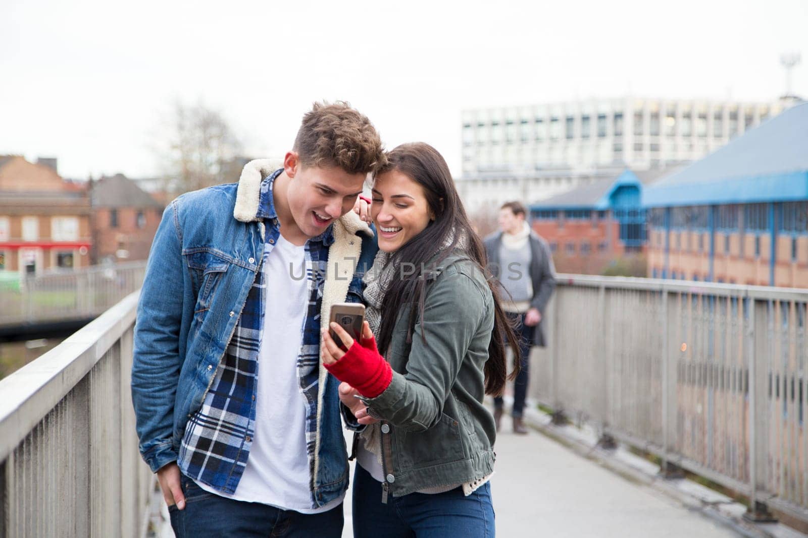 Young couple taking a selfie on a smartphone in the city