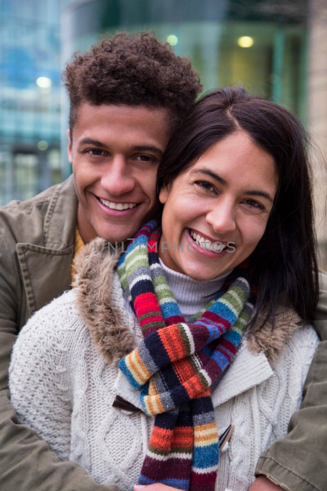 Attractive young couple posing together in the city