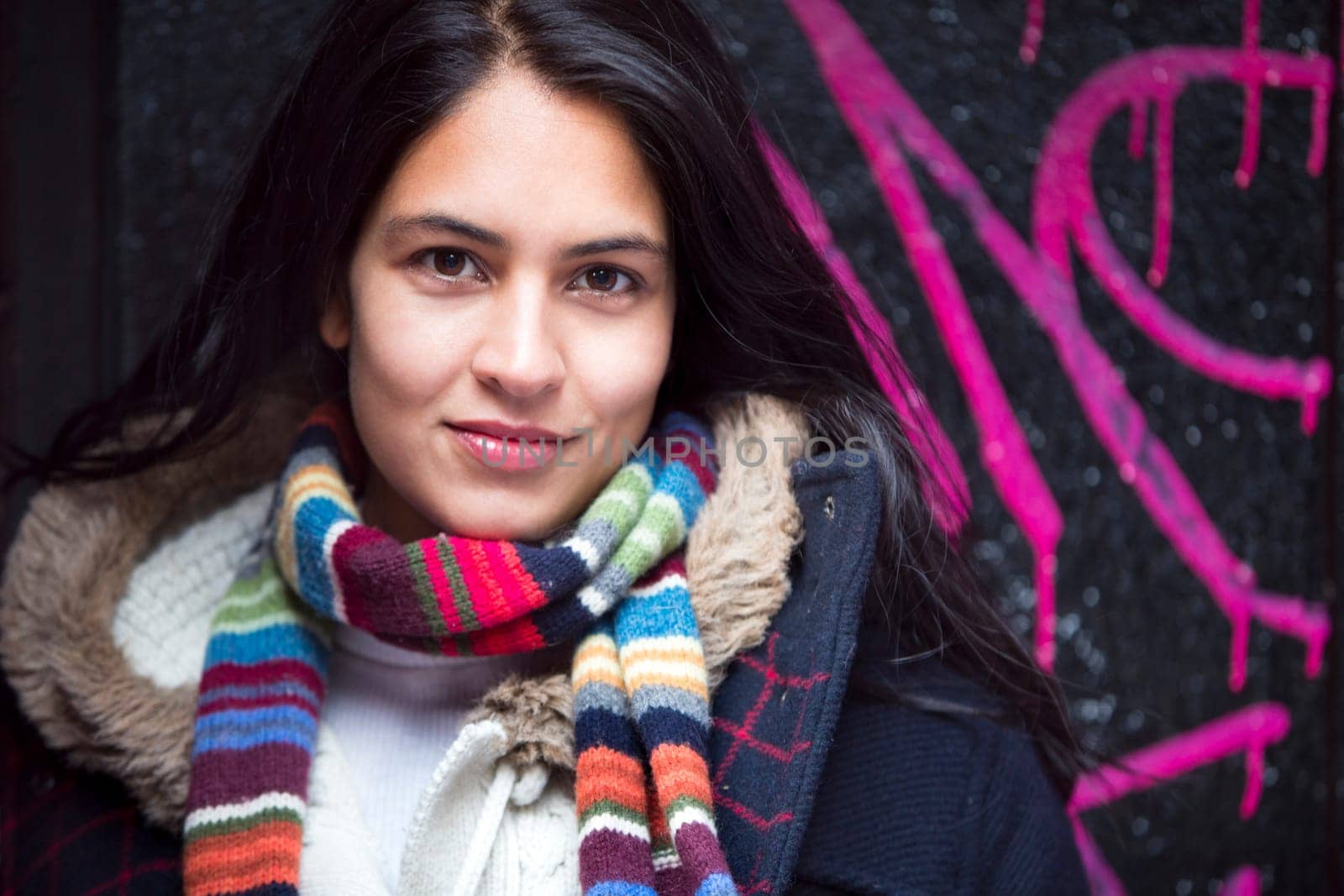 Portrait of an attractive, young, woman against an urban background in the city