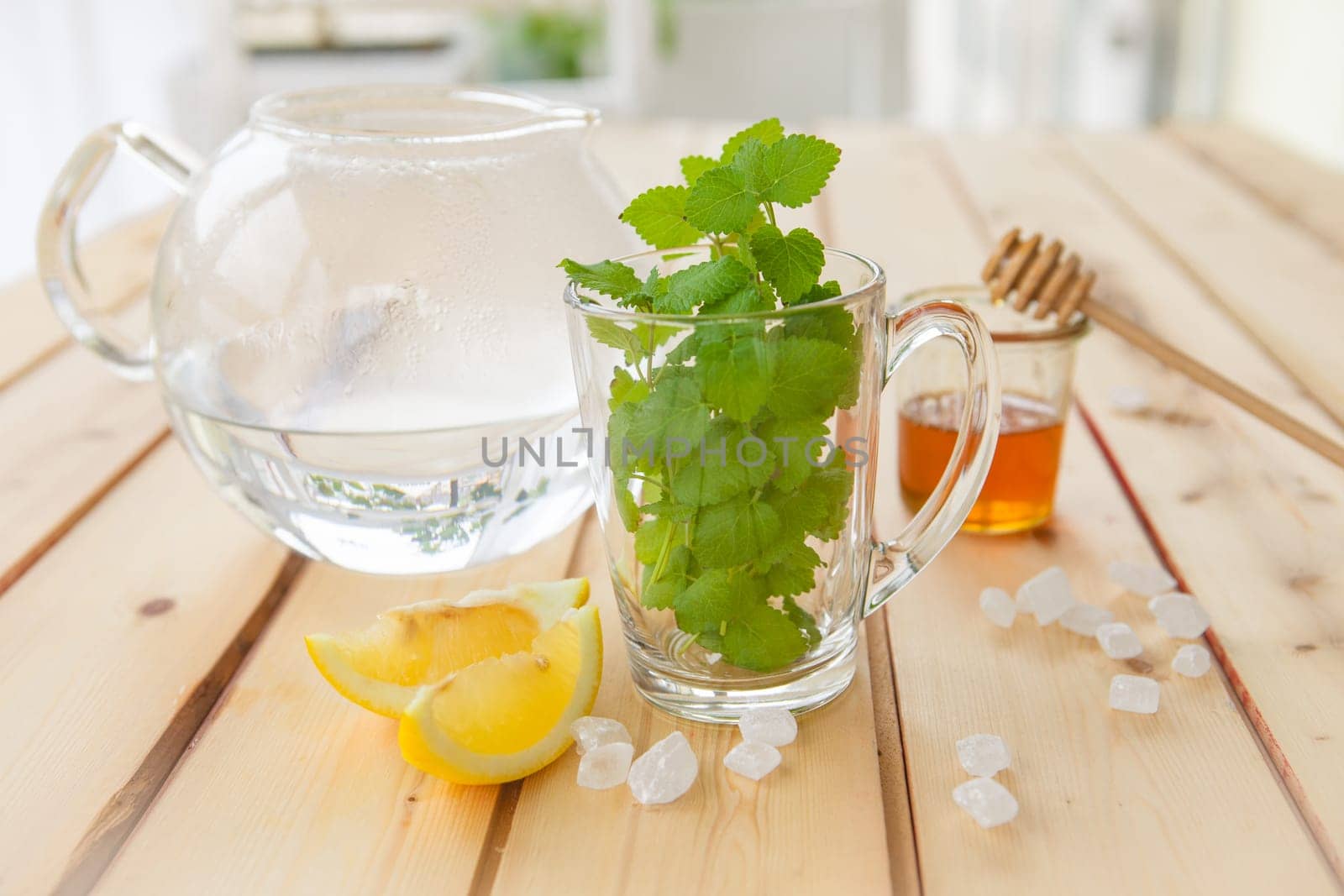Cup of fresh tea with mint and lemon