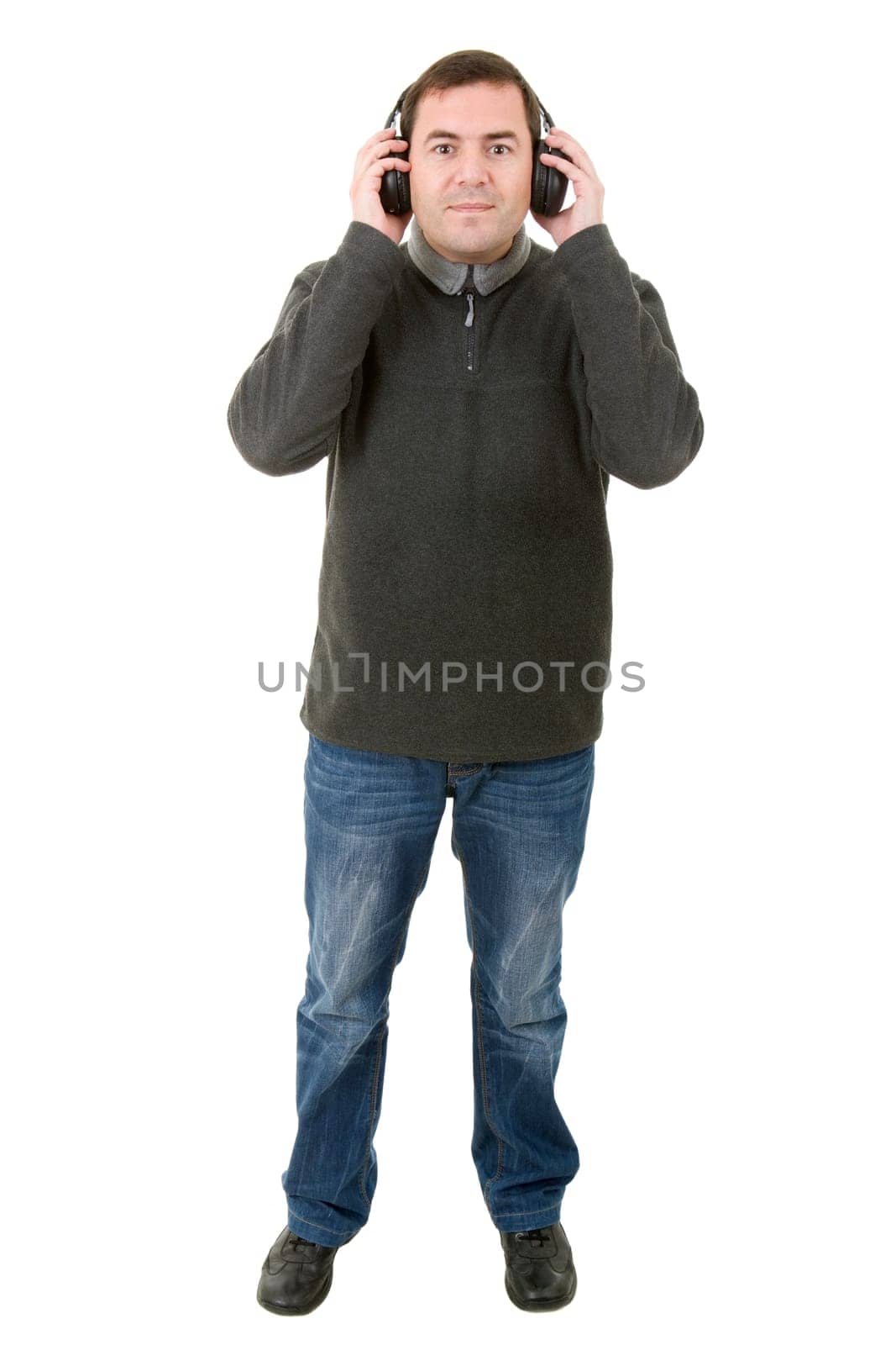 Young man listening to music, full length, isolated