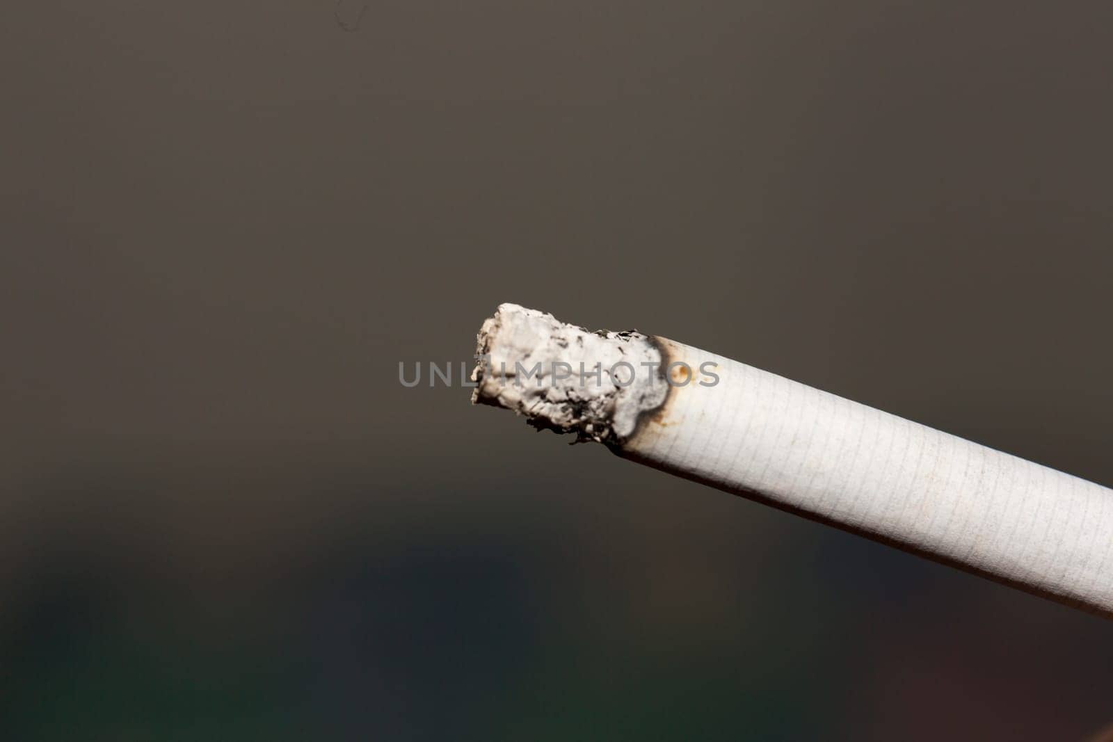 Burning Cigarette close up macro image.