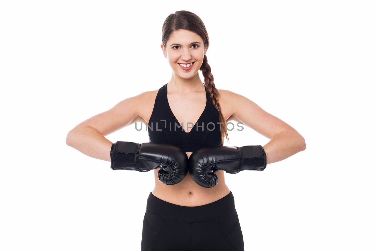 Young woman wearing boxing gloves