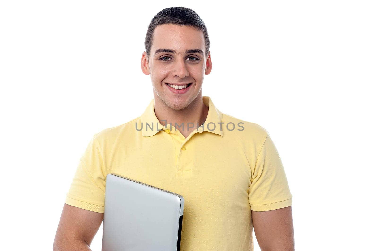 Teenager boy holding his laptop