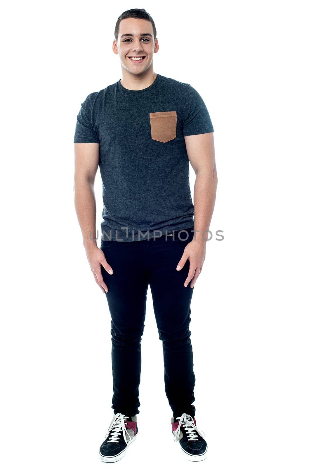 Teenager boy posing, full length portrait.