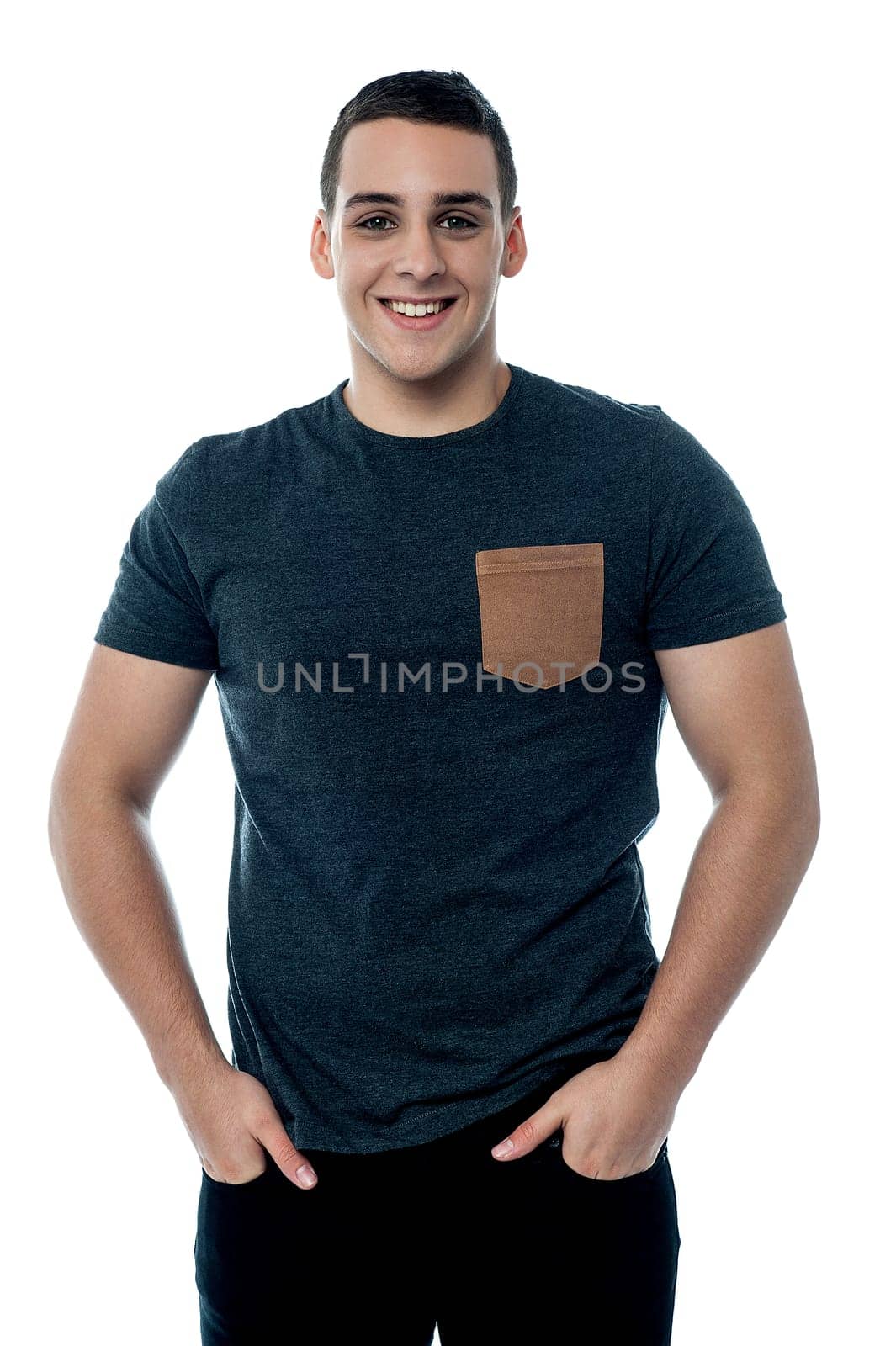 Cheerful boy posing with hands in pocket