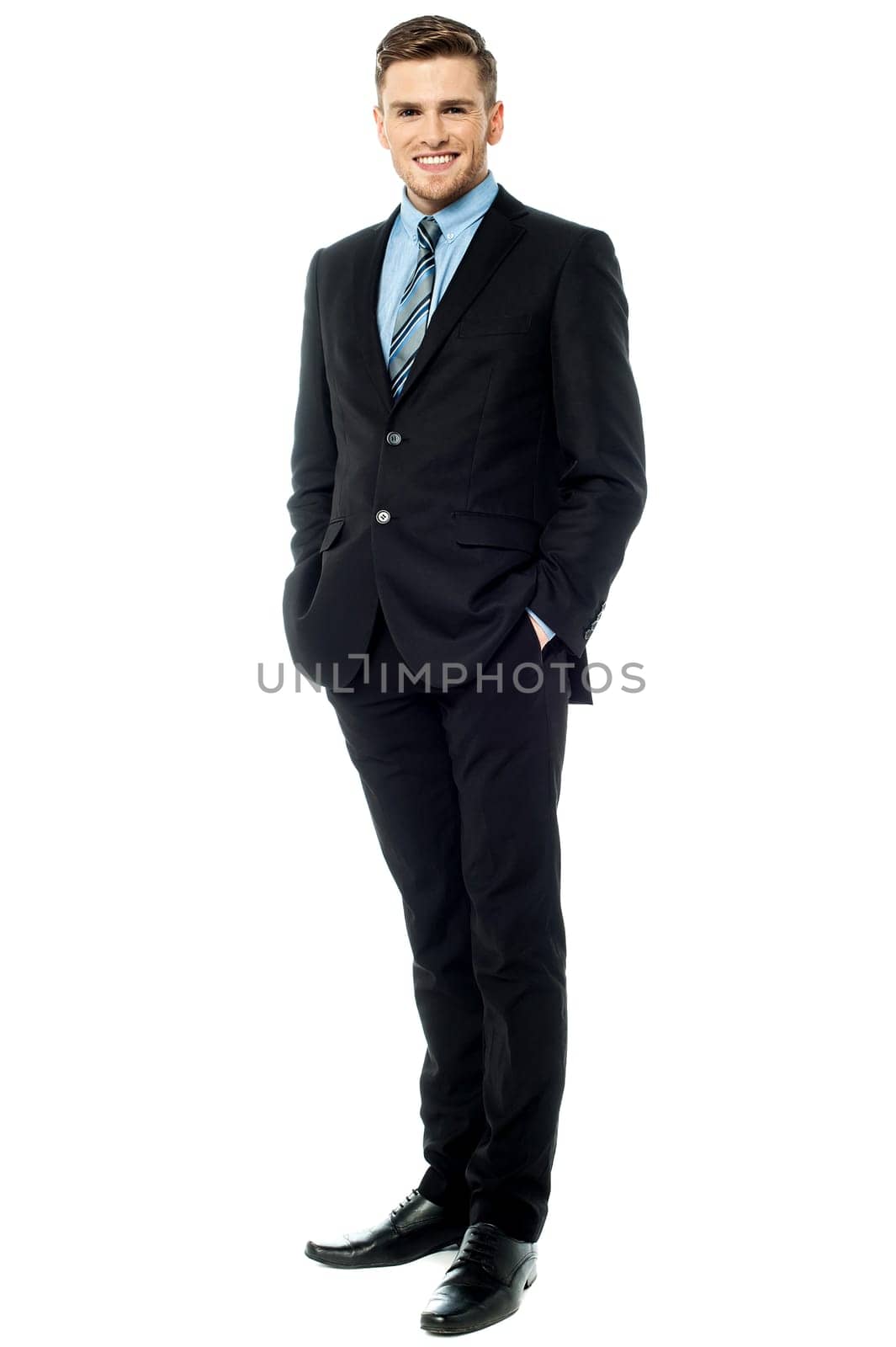 Businessman posing stylishly on white background