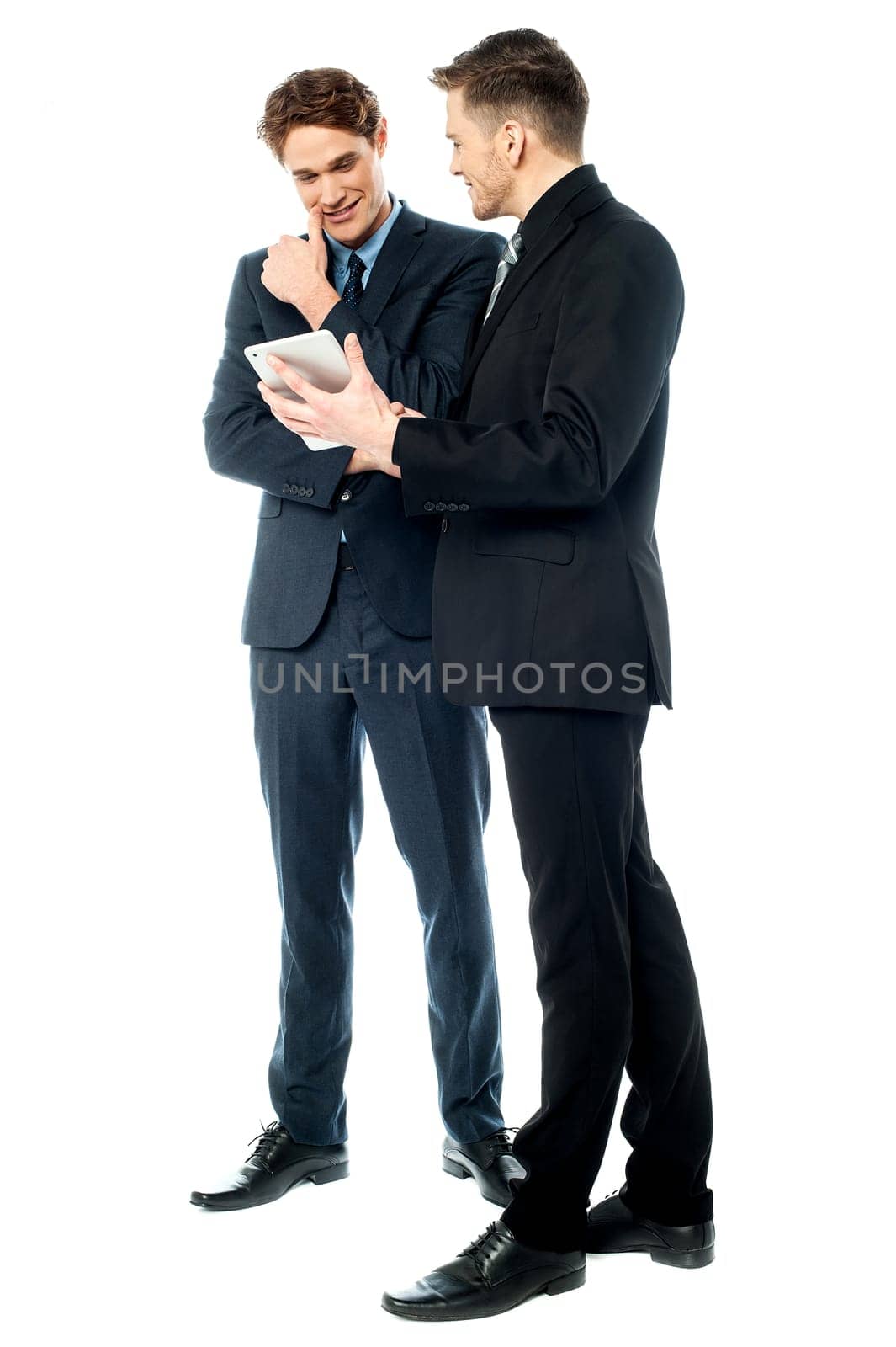 Business executive showing tablet to his peer