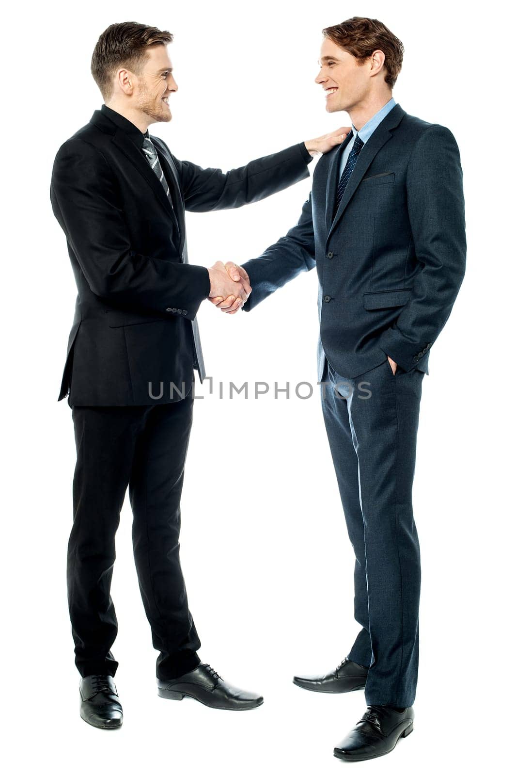 Cheerful entrepreneurs shaking hands