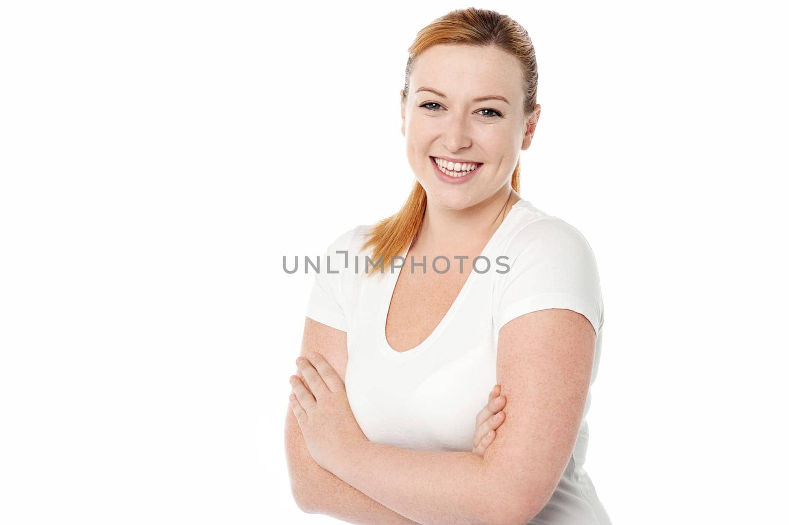 Young smiling lady posing over white