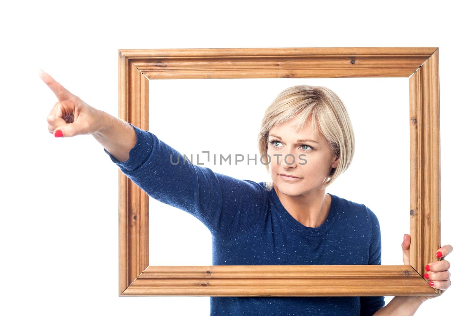 Woman pointing out of the window frame