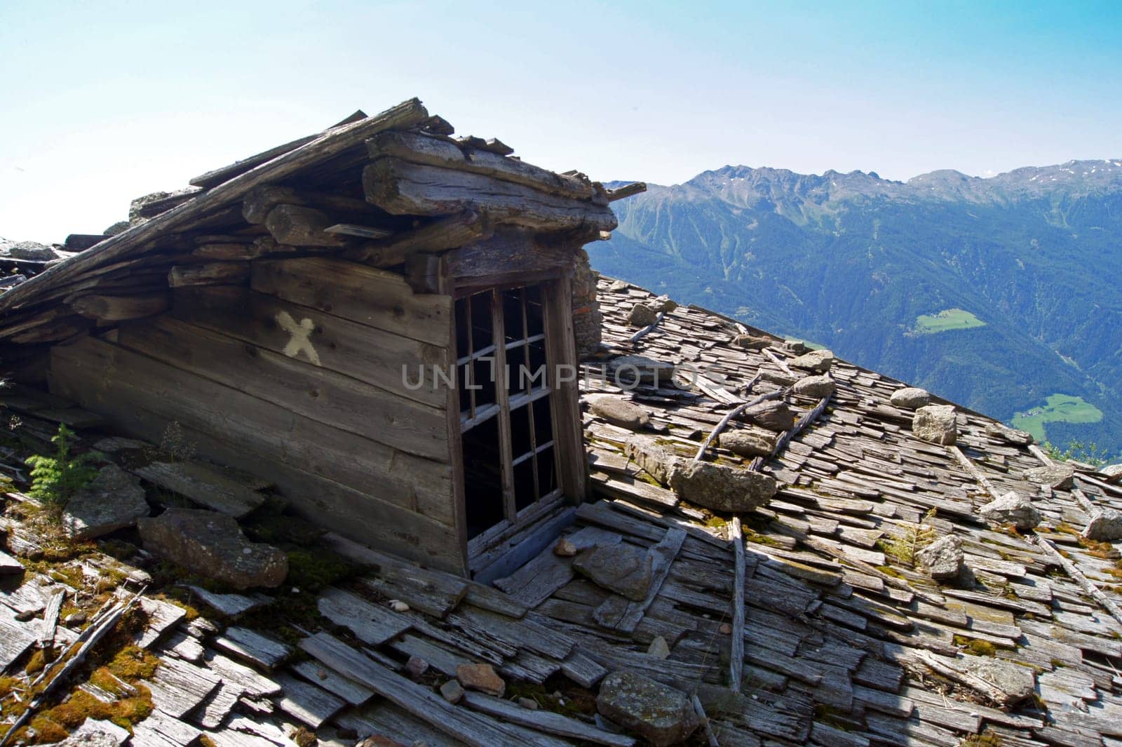 Old roof with wooden shingles at old alpine pasture in South Tyrol,Italy