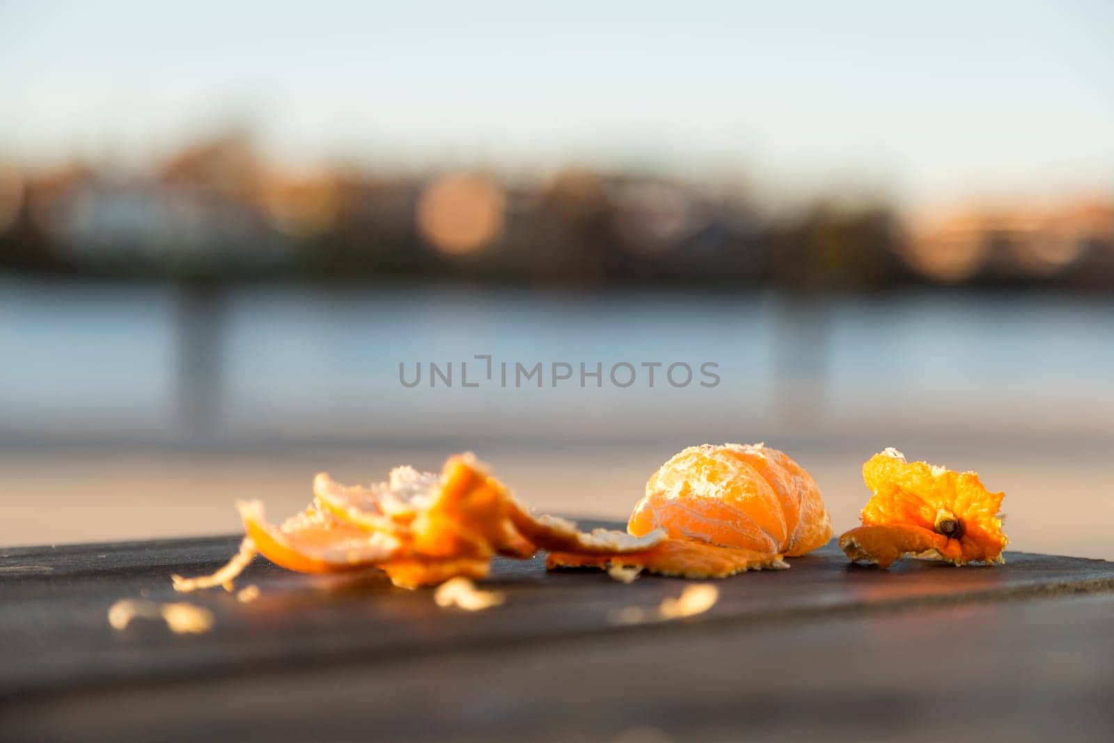 Pealed Half Eaten Clementine one table.