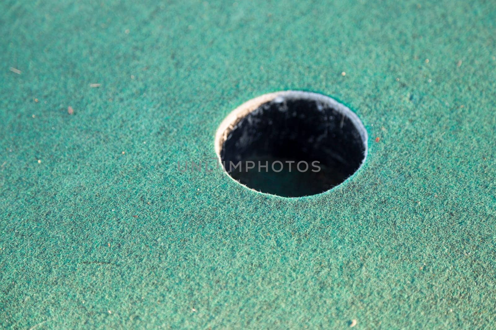 Miniature Golf Course Cup Close up.